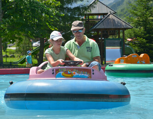 Wildpark Ferleiten Father with daughter in a boat in Ferleiten game park