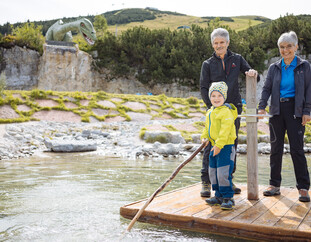 Family by the pond in Triassic Park