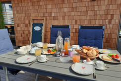 Dining table, generous place for breakfast outside Dining table, generous place for breakfast outside